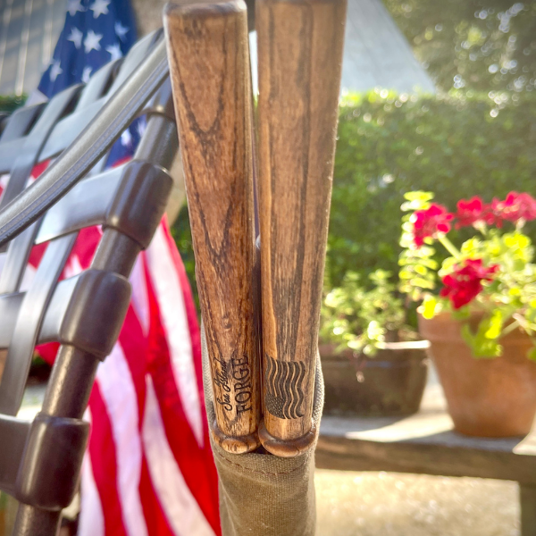 Celebrate holidays with roasting sticks for marshmallows and hotdogs. American flag engraved on handle